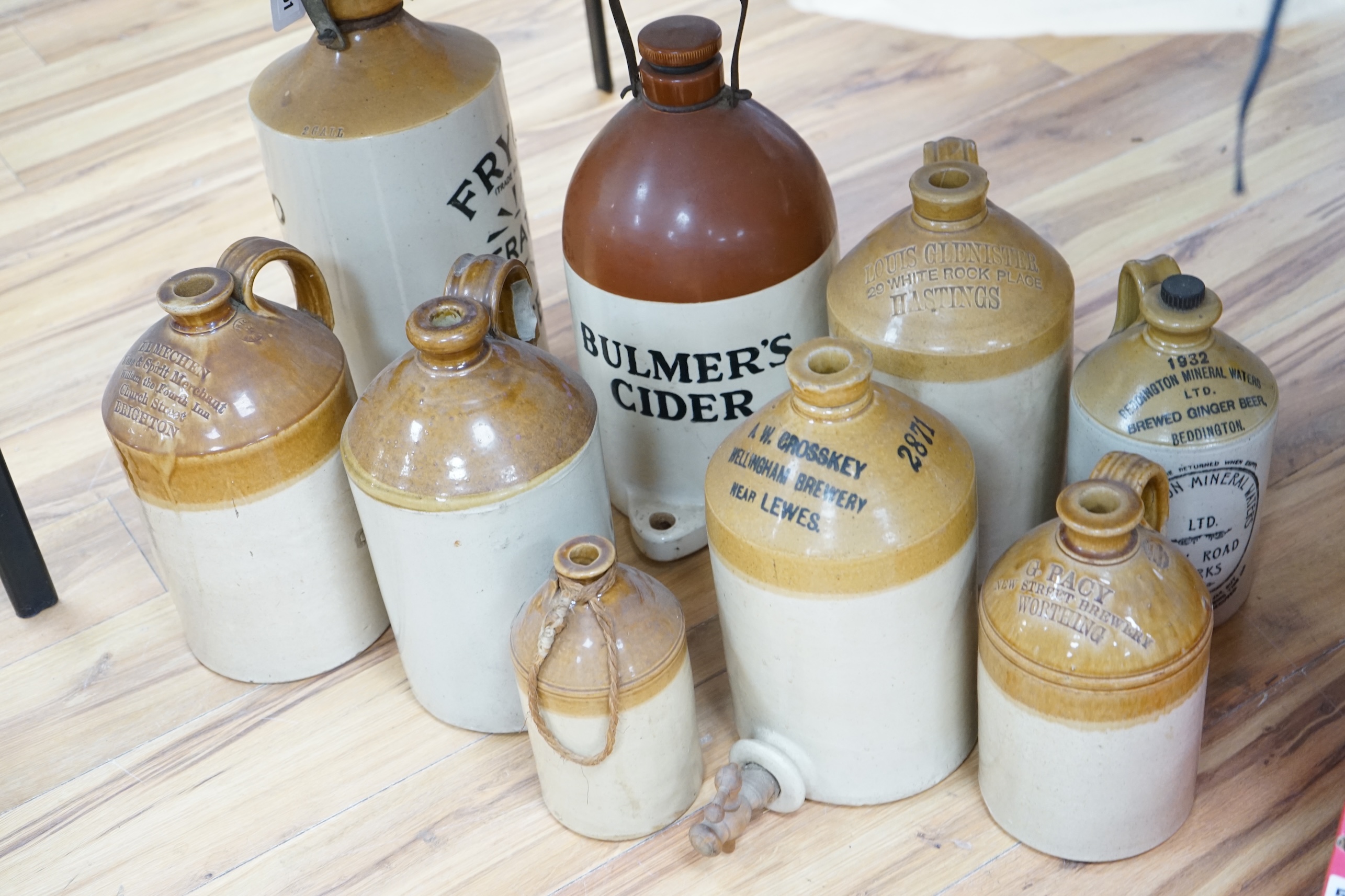 Nine various stoneware vessels including local brewers such as Lewes, Worthing, Hastings and Brighton. Condition - fair to good